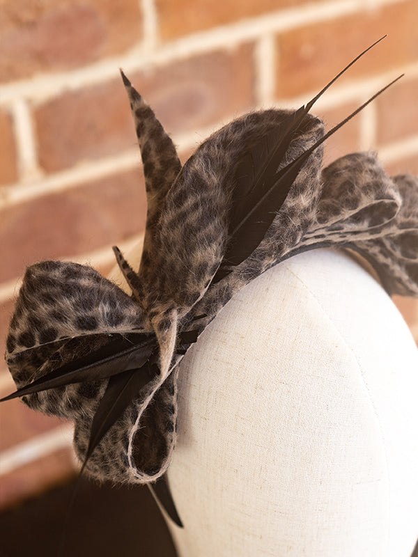 Close up of felt bow design on top of the headpiece.