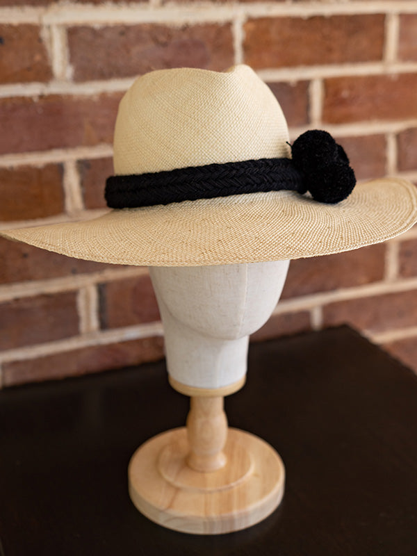 Side view of the natural panama fedora hat.