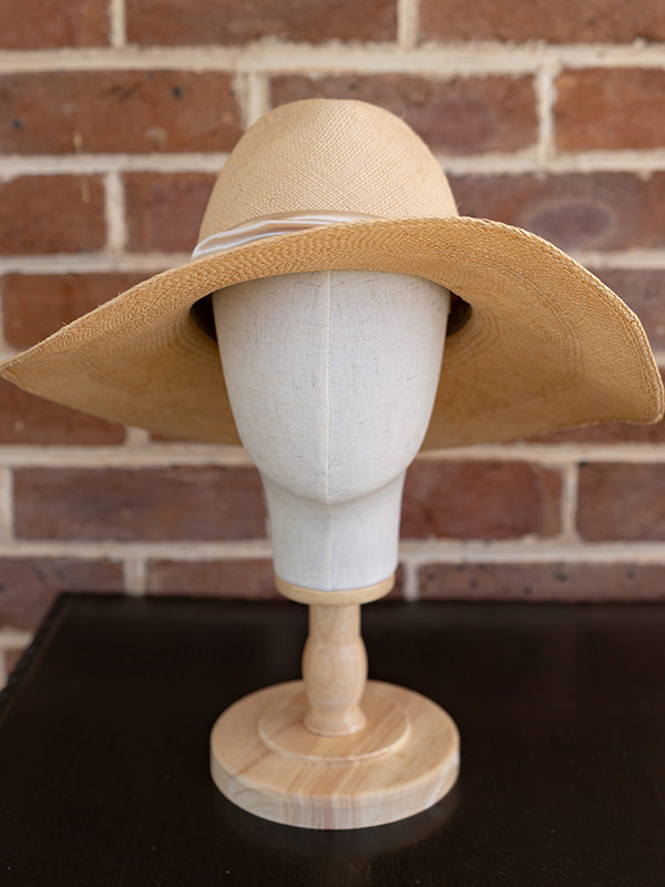 Front view of natural panama fedora hat.