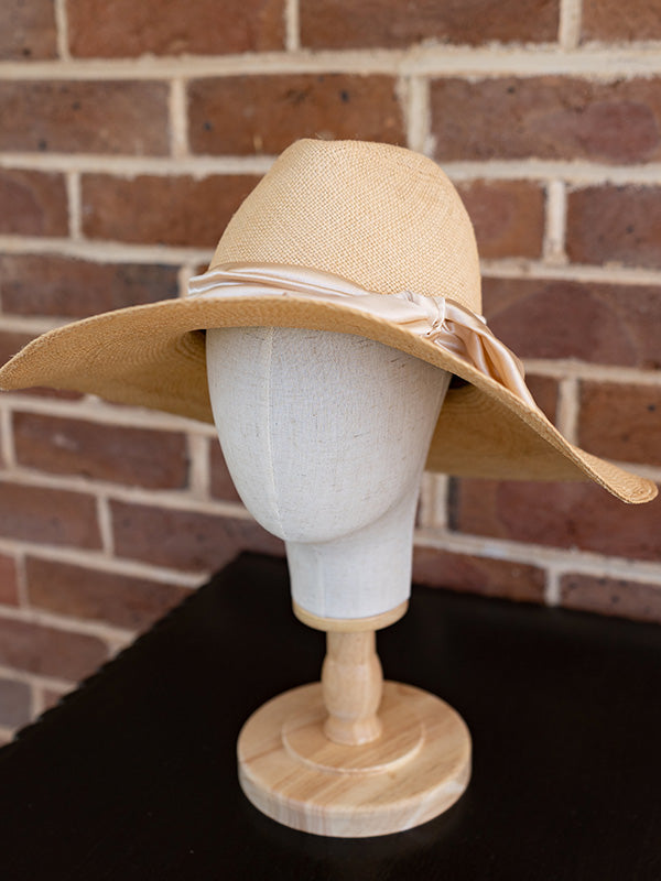 Side view of natural panama fedora hat.