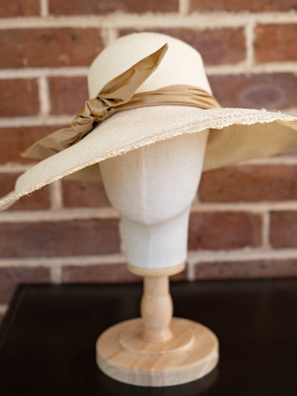Front view of the super wide brimmed natural panama hat.