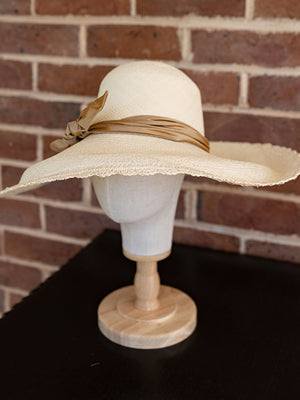 Side view of the super wide brimmed natural panama hat. Beautiful scalloped edging around the hat.